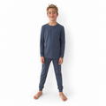 Boy wearing Vintage Indigo Bamboo PJs, long-sleeve top and jogger pants in faded indigo, front view