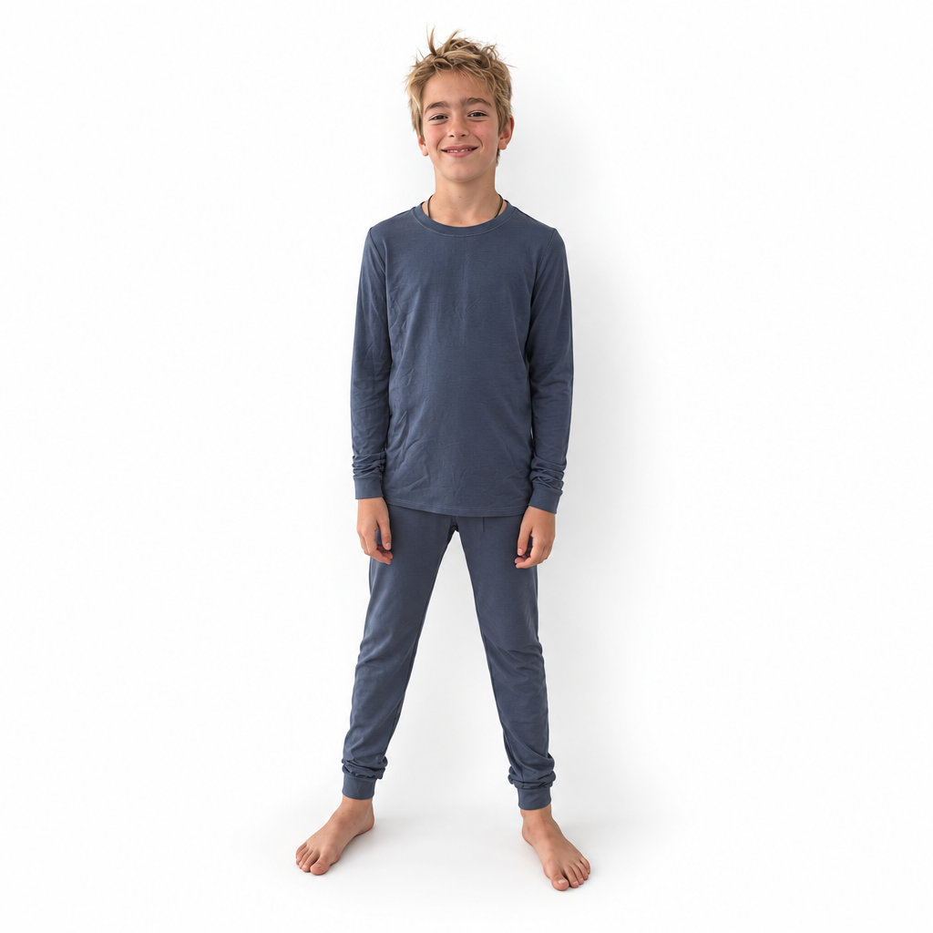 Boy wearing Vintage Indigo Bamboo PJs, long-sleeve top and jogger pants in faded indigo, front view