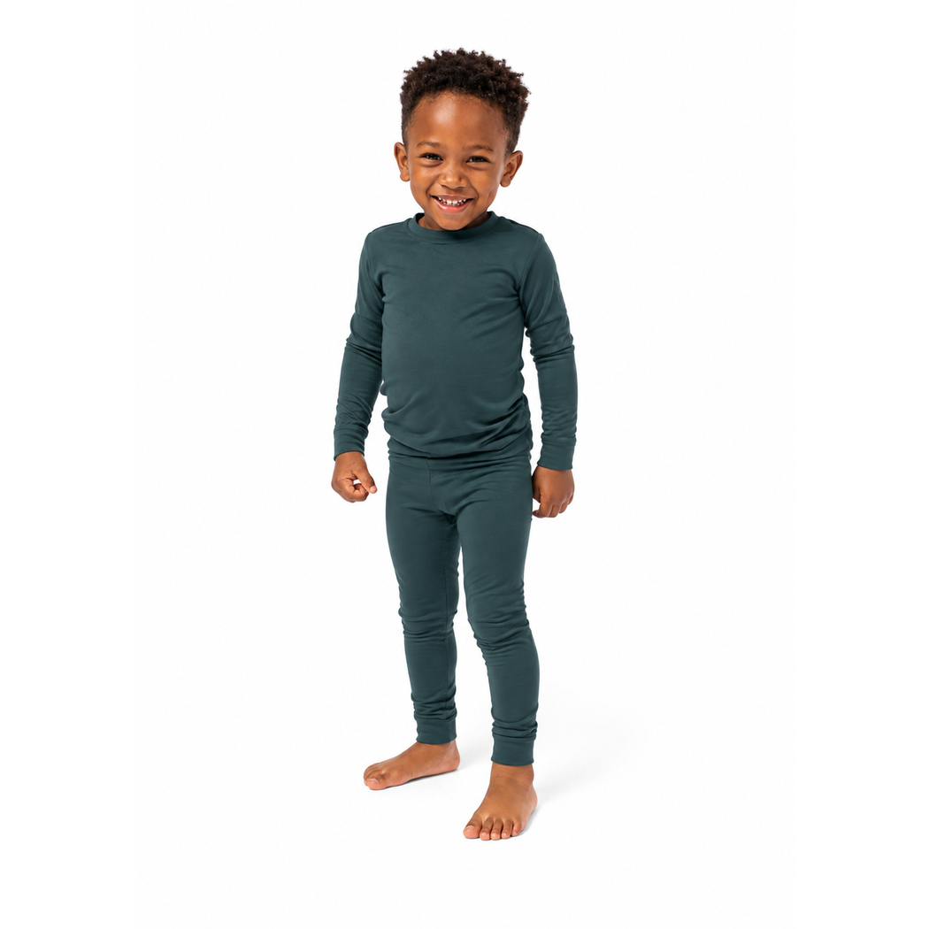 Smiling young boy wearing Sea Moss Bamboo PJs, front view