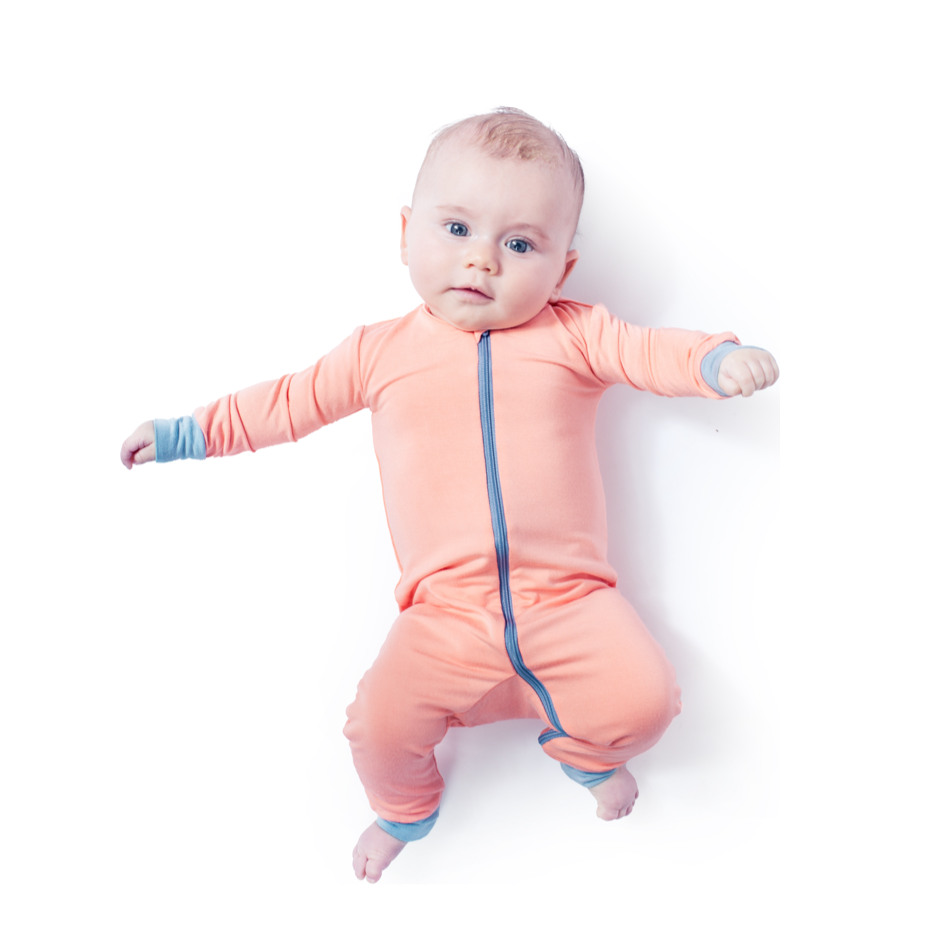 Baby wearing Apricot Bamboo Zip Sleeper in orange, front view