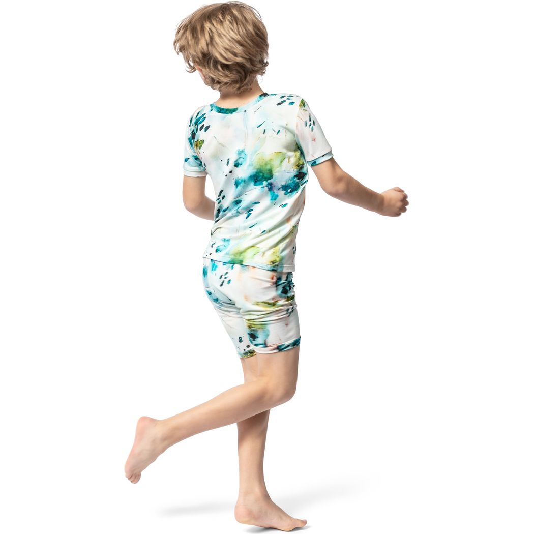Boy wearing Aurora Bamboo Shorties PJ Set in blue, side view