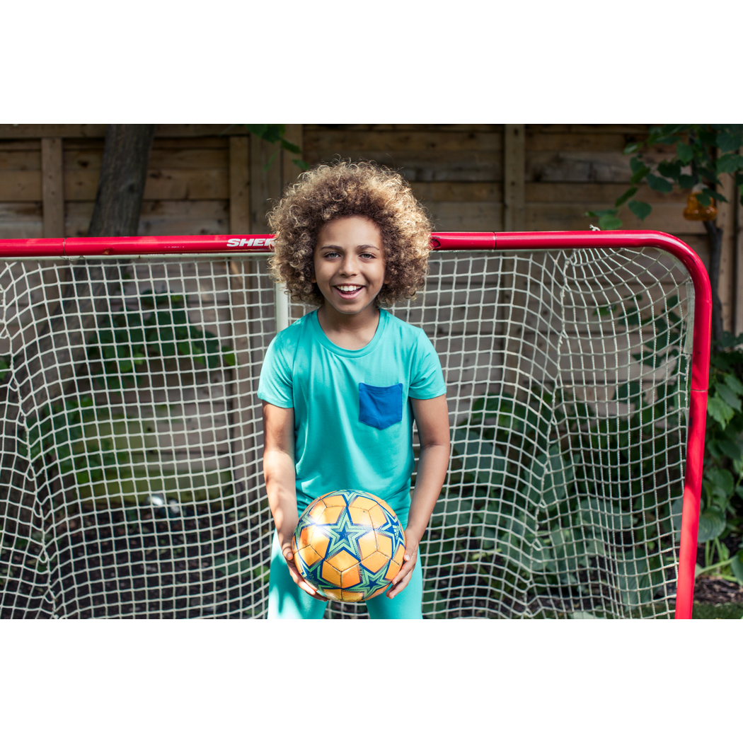 Boy wearing Bahamas Kids T-Shirt in blue, lifestyle photo