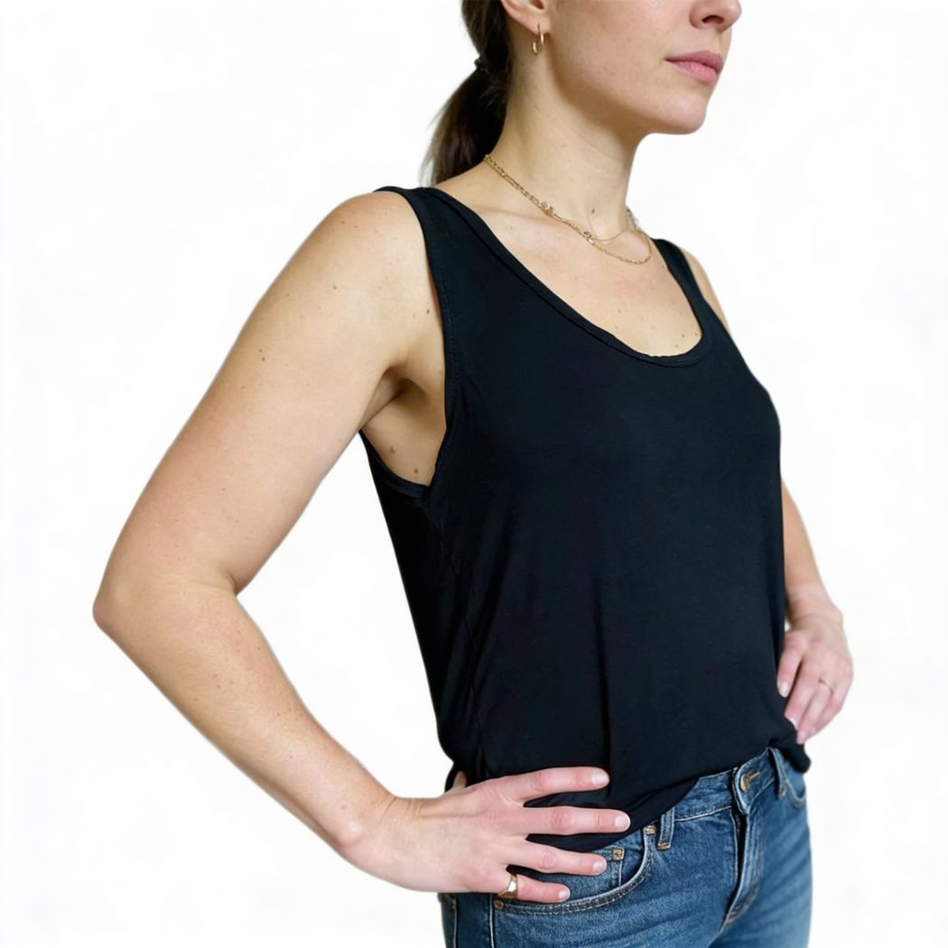 Woman wearing Women's Basics Tank Top in black, front view