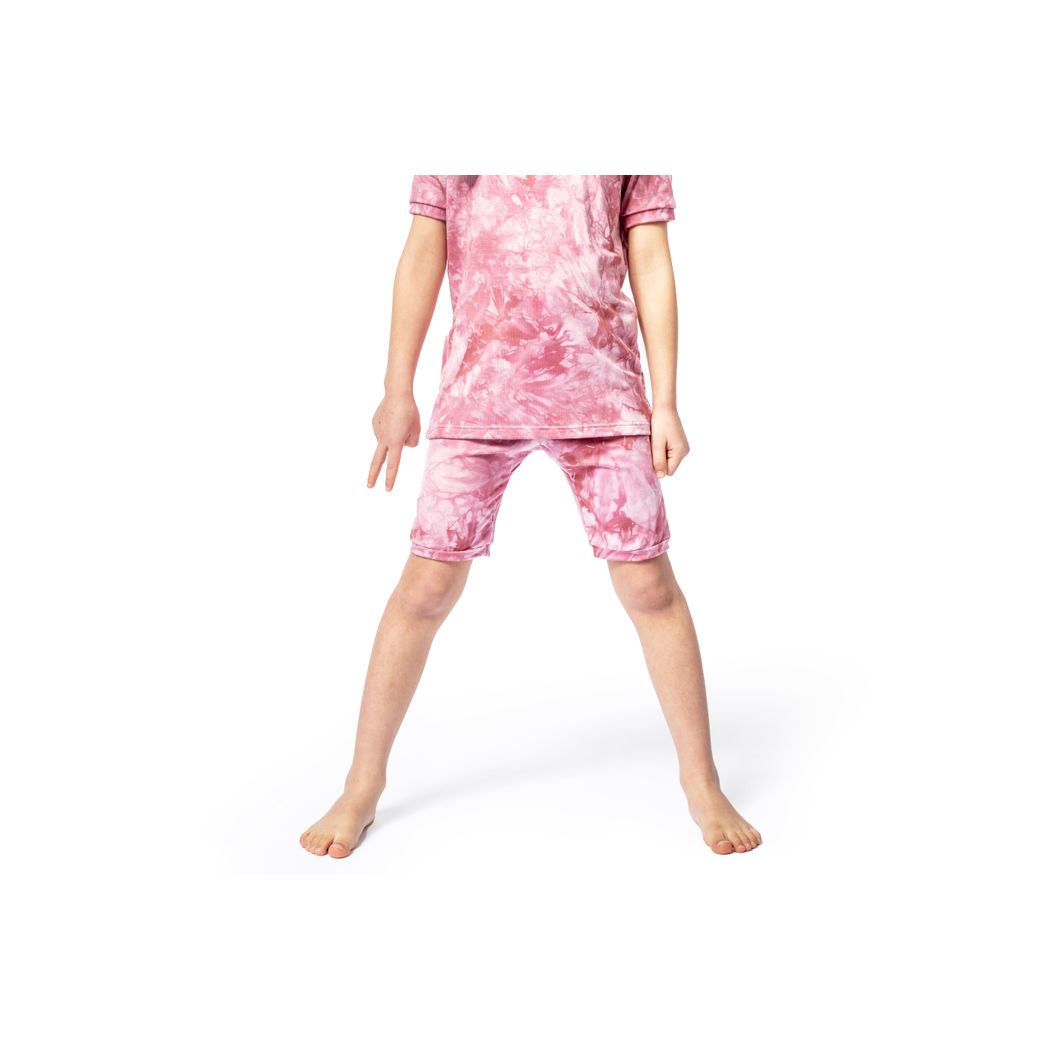 Child wearing Berry Tie Dye Bamboo Shorties PJ Set in pink, front view