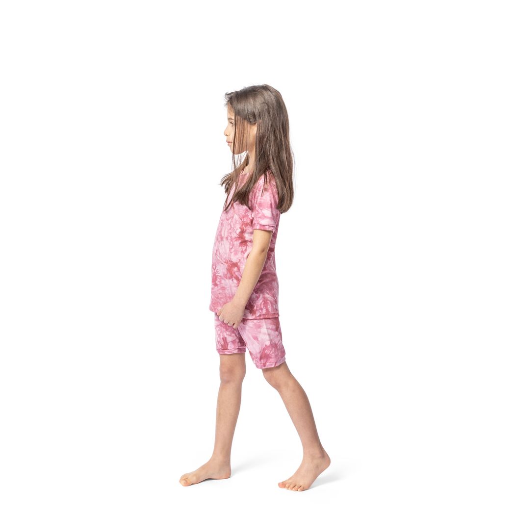 Girl wearing Berry Tie Dye Bamboo Shorties PJ Set in pink, side view
