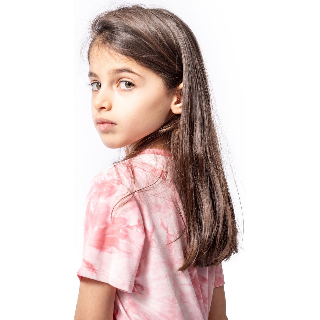 Girl wearing Berry Tie Dye Kids T-Shirt in pink, side view