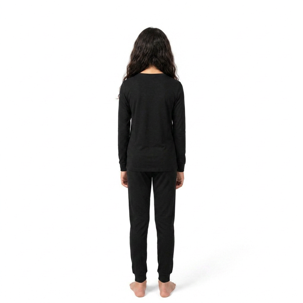 Girl wearing PIKA solid black bamboo pyjama set, back view