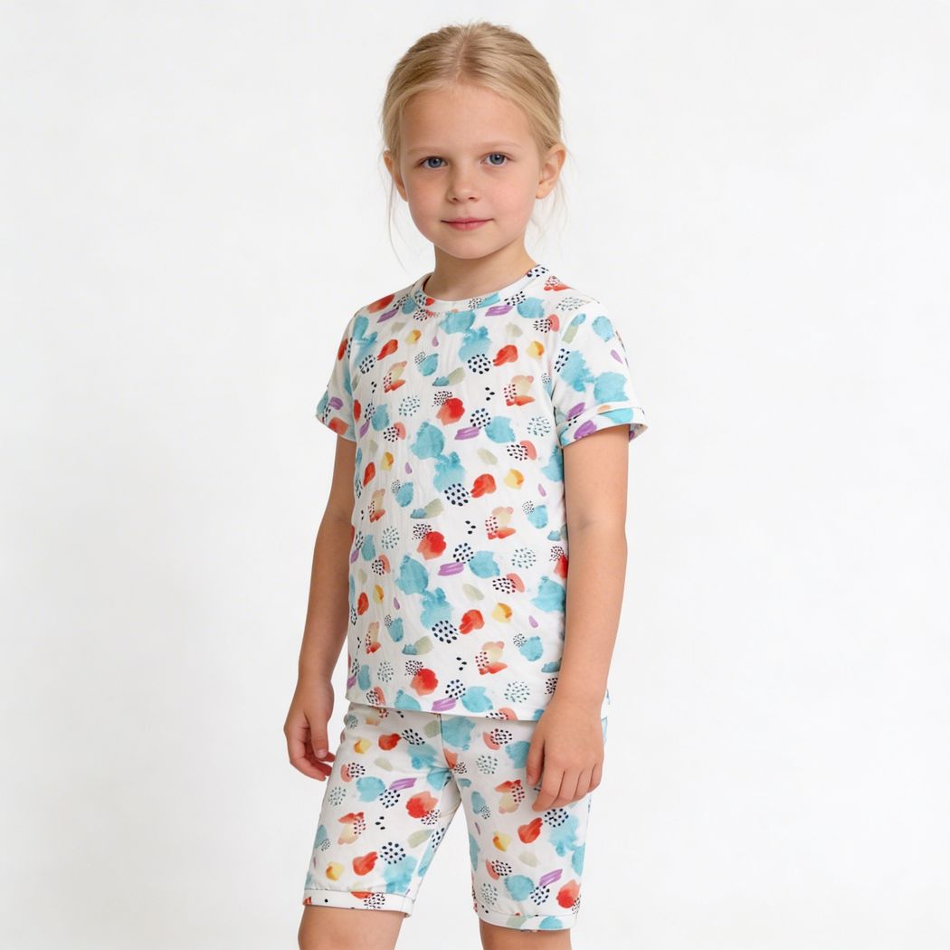 Girl wearing Confetti Bamboo Shorties PJ Set in multicolor, front view
