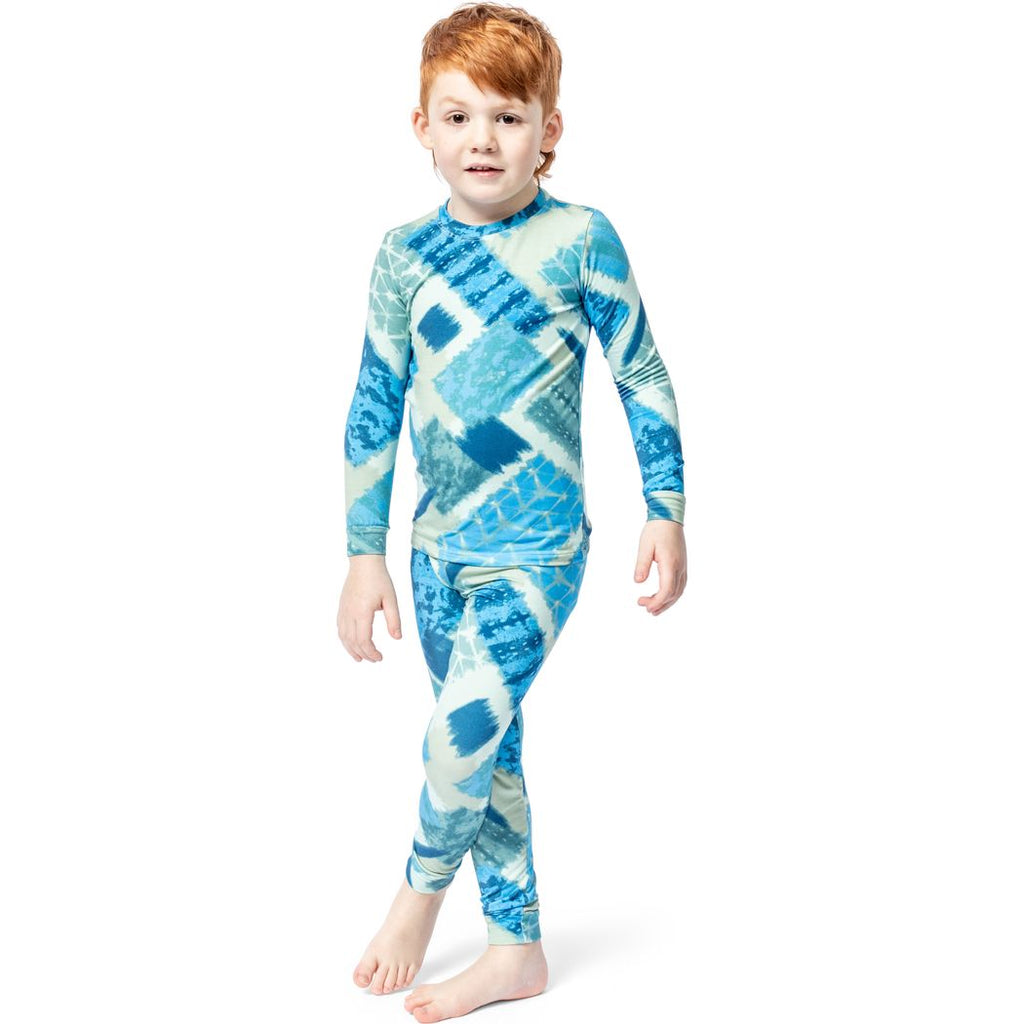 Boy wearing Cosmic Kids Bamboo PJs in blue, front view