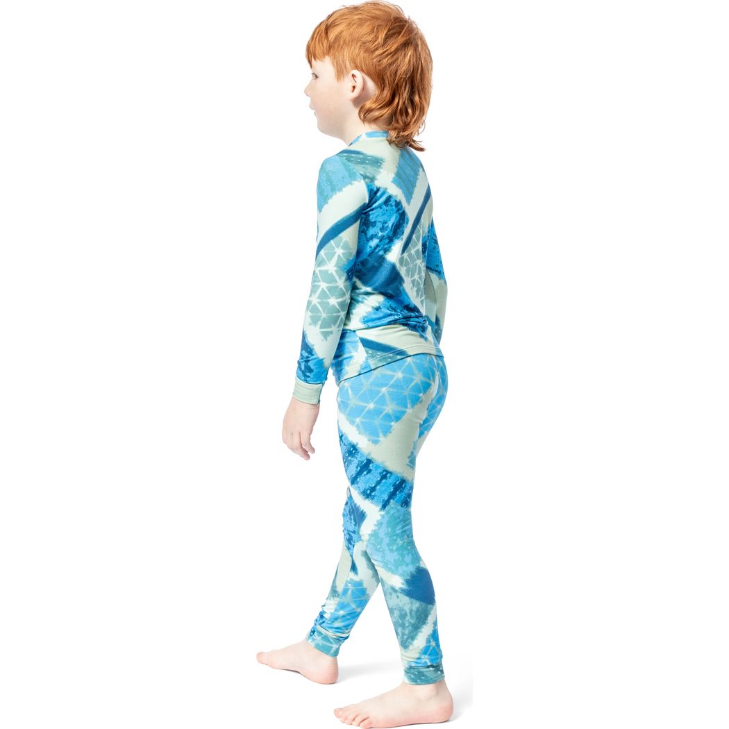 Boy wearing Cosmic Kids Bamboo PJs in blue, side view