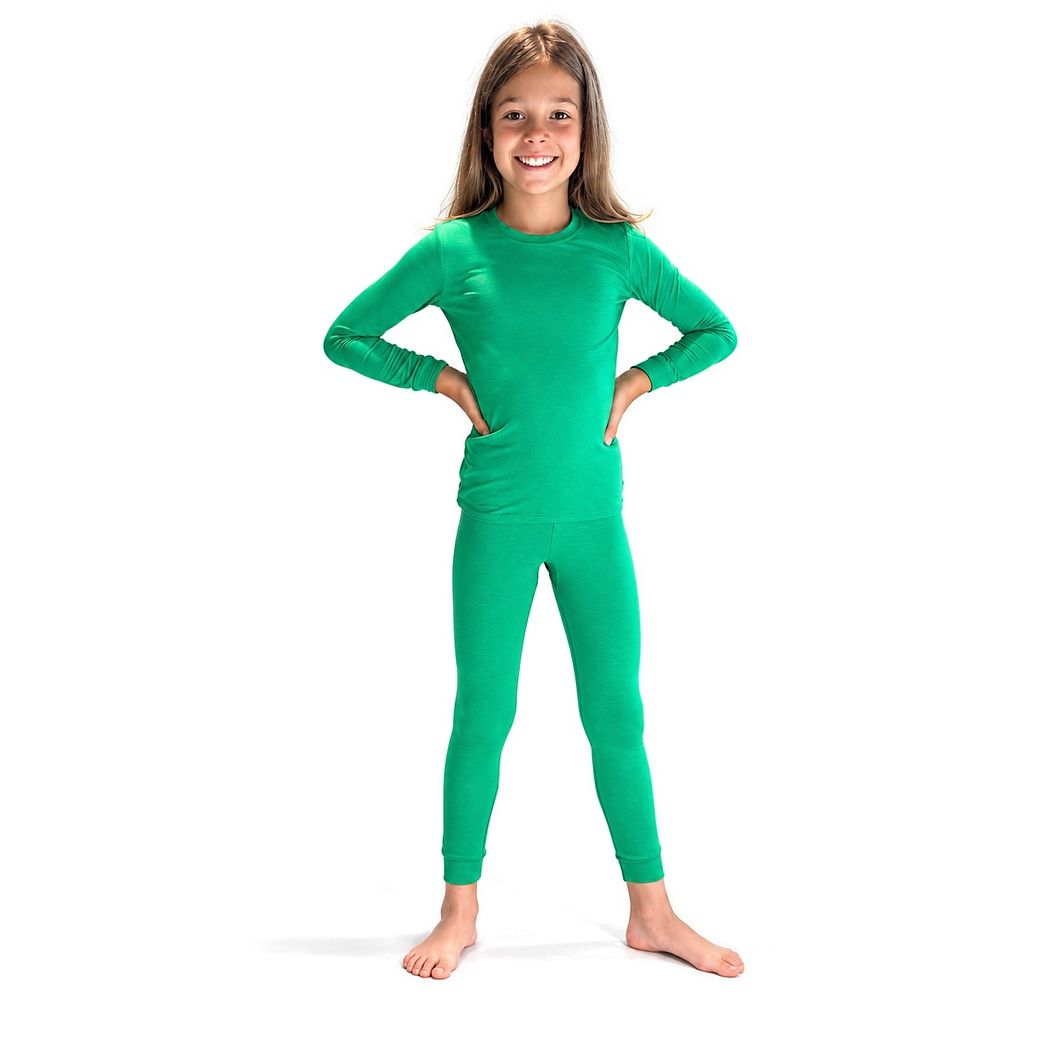 Girl with hands on hips wearing Deep Mint Bamboo PJs in bright green, front view