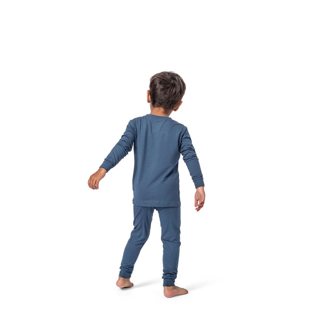Toddler wearing Denim Kids Bamboo PJs in blue, back view