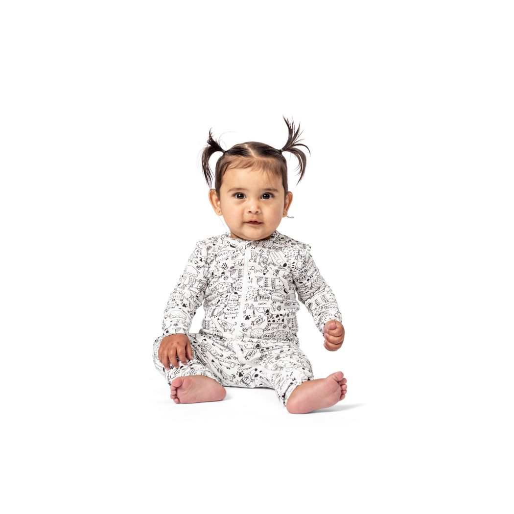 Baby wearing Dog Show Bamboo Zip Sleeper in neutral tones, front view