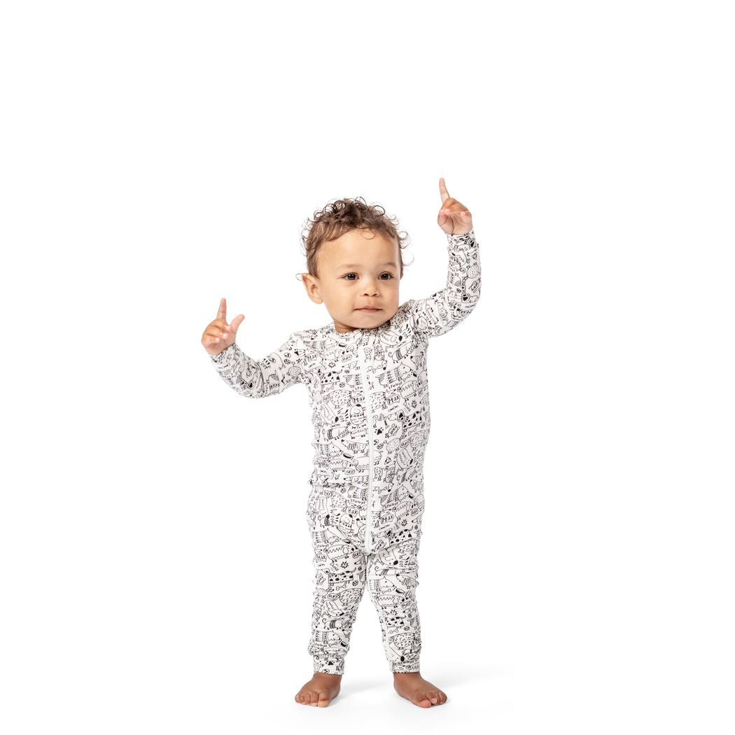 Baby wearing Dog Show Bamboo Zip Sleeper in neutral tones, front view