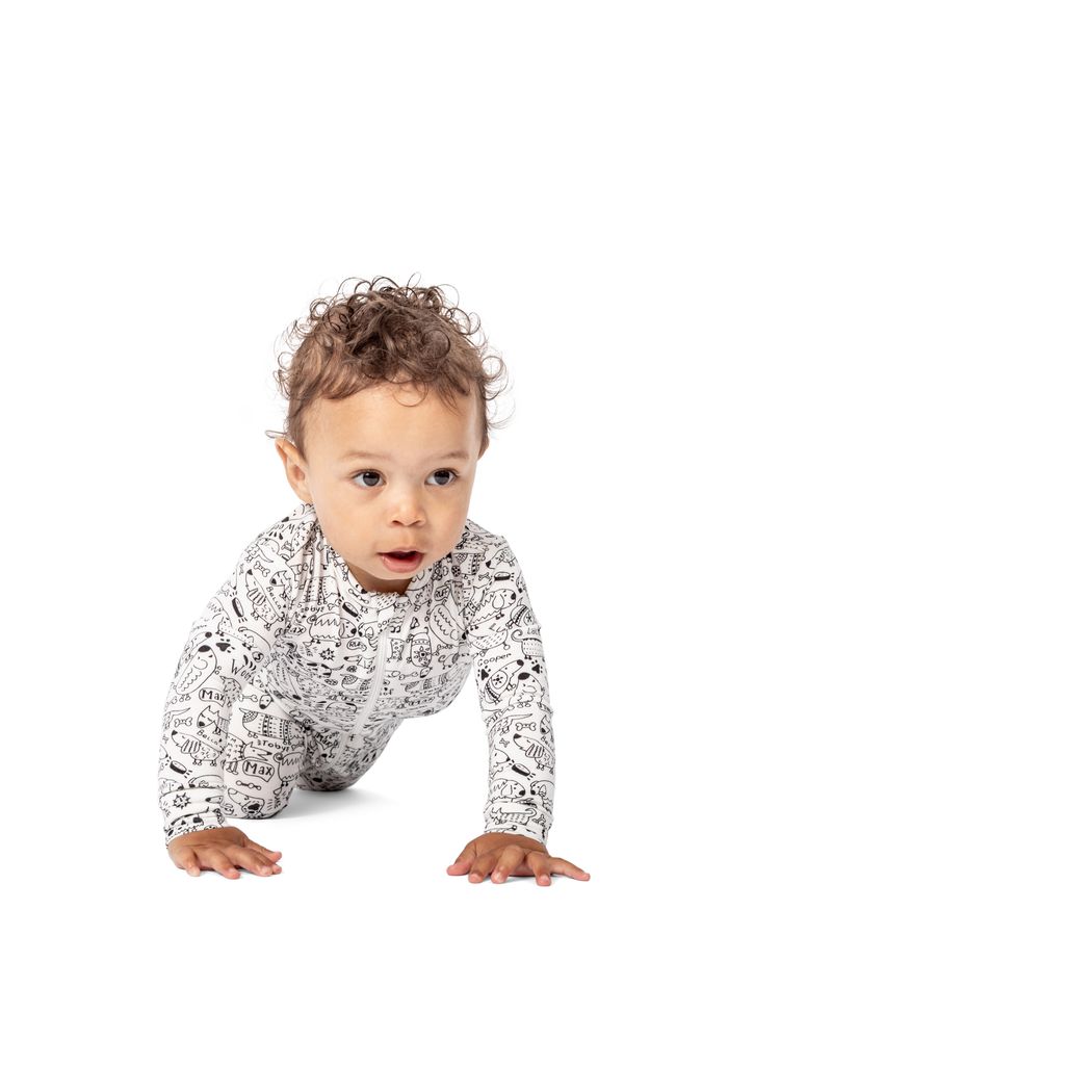 Baby wearing Dog Show Bamboo Zip Sleeper in neutral tones, front view