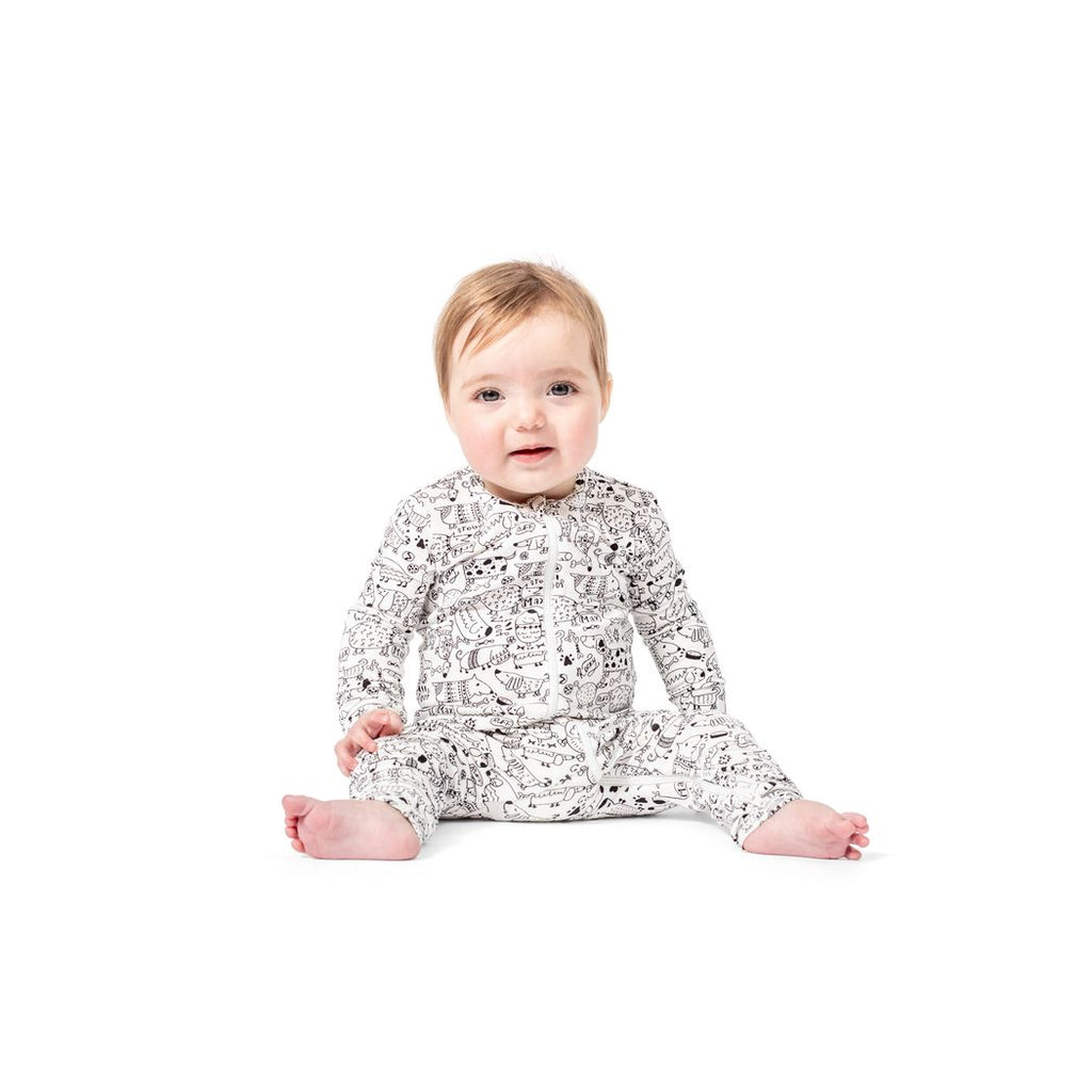 Baby wearing Dog Show Bamboo Zip Sleeper in neutral tones, front view