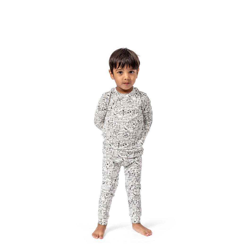 Boy wearing Dog Show Kids Bamboo PJs in neutral tones, front view