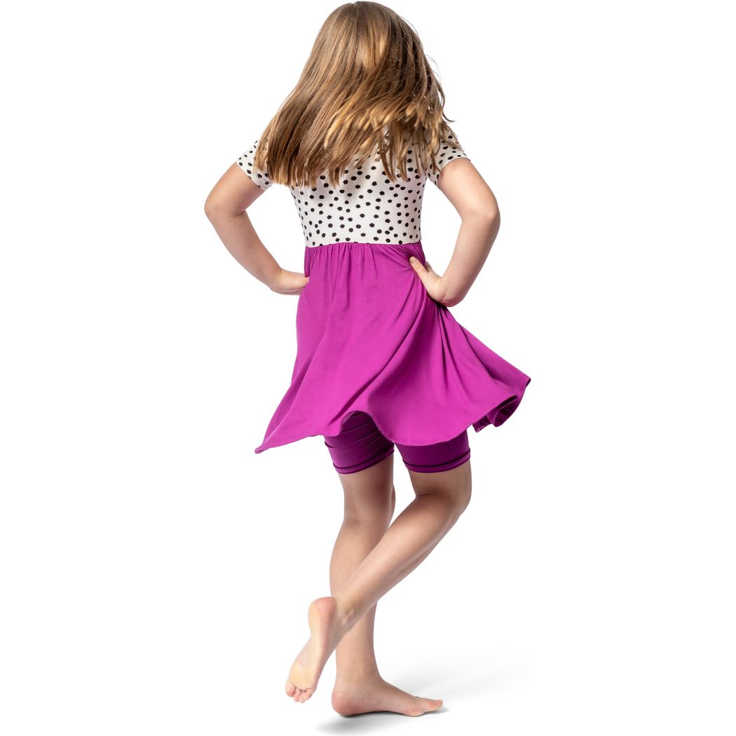 Girl wearing Dot Fuchsia Twirl Dress in pink, back view