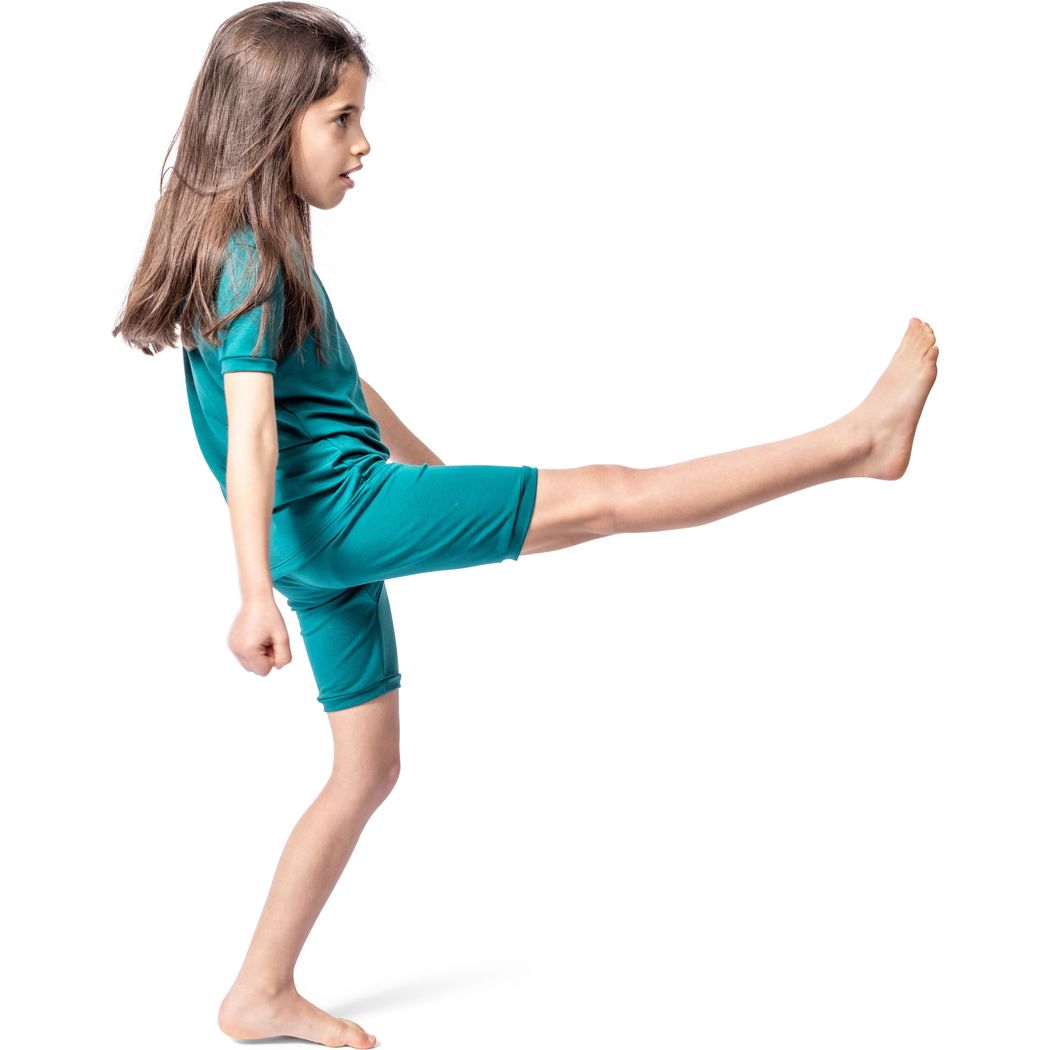 Girl wearing Emerald Bamboo Shorties PJ Set in green, side view