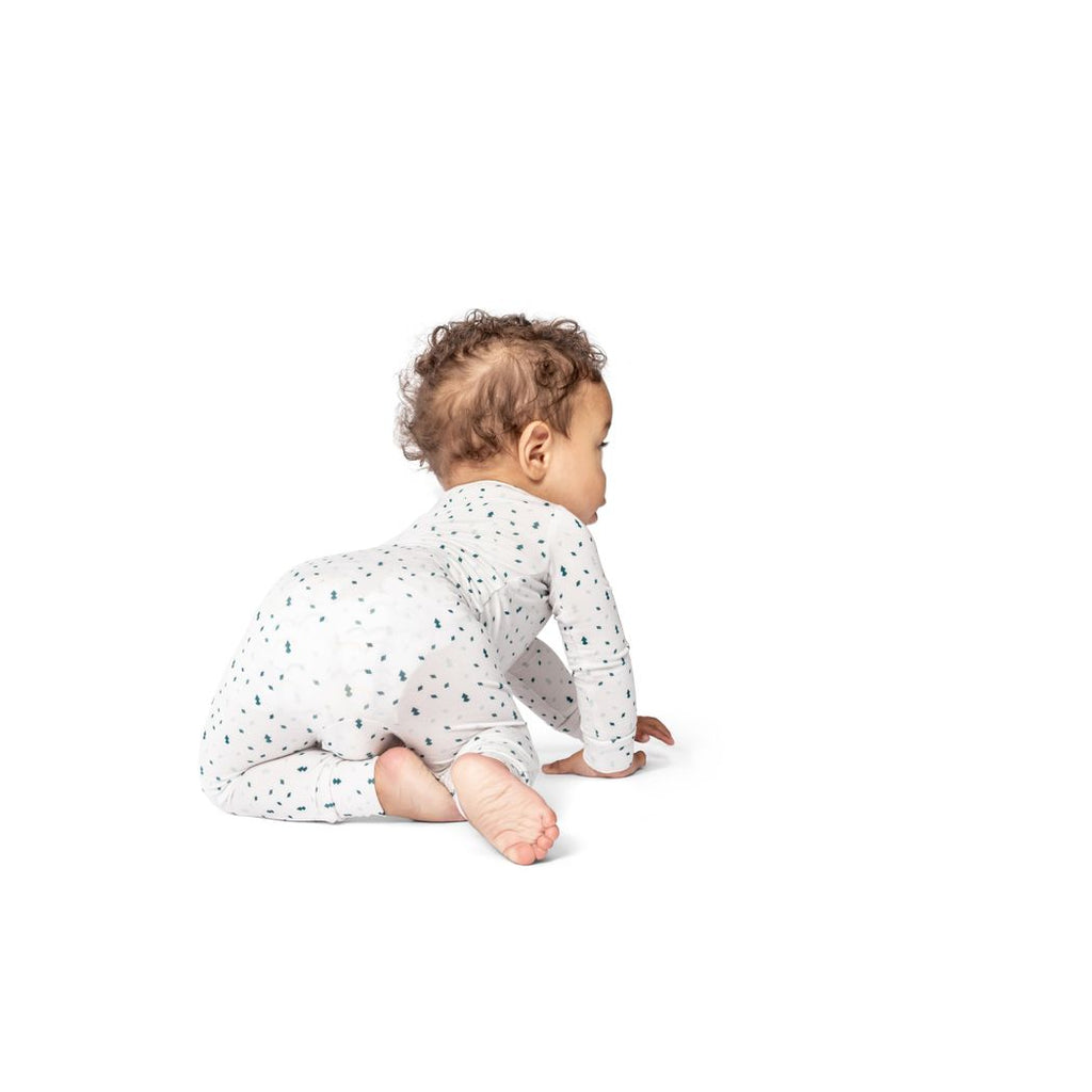 Baby wearing Evermint Bamboo Zip Sleeper, side view