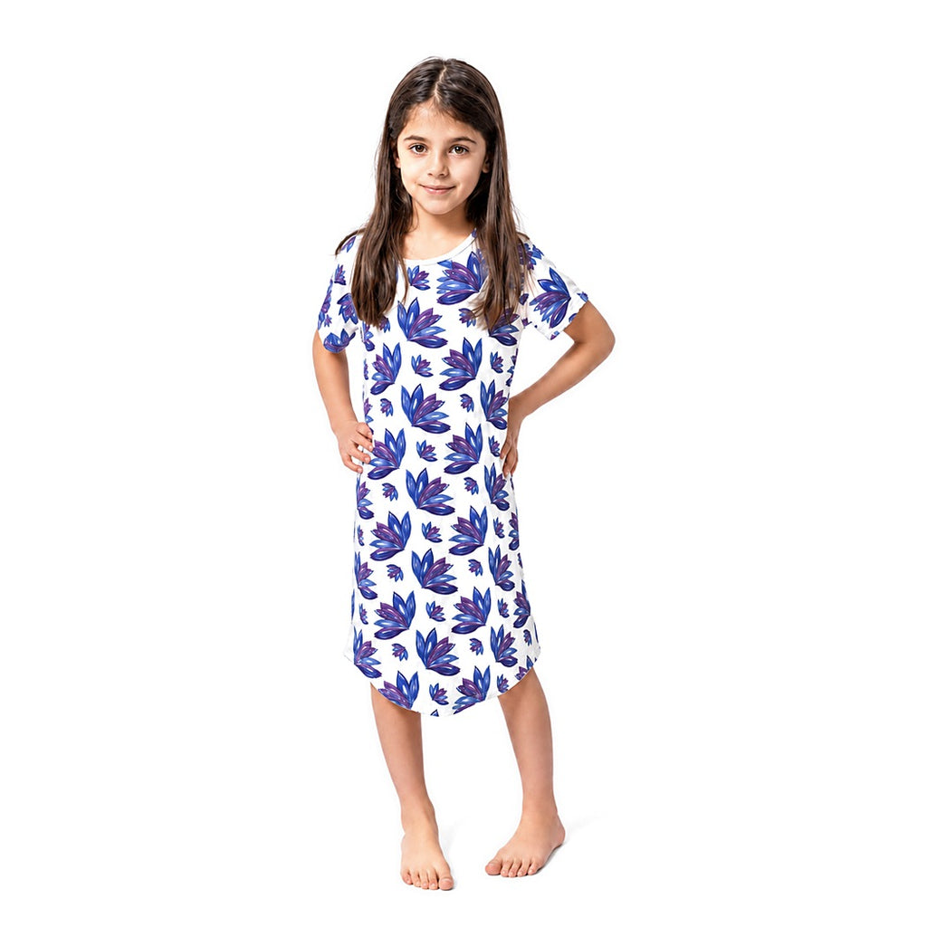 Girl with hands on hips wearing the Lily Kids Snuggle Dress