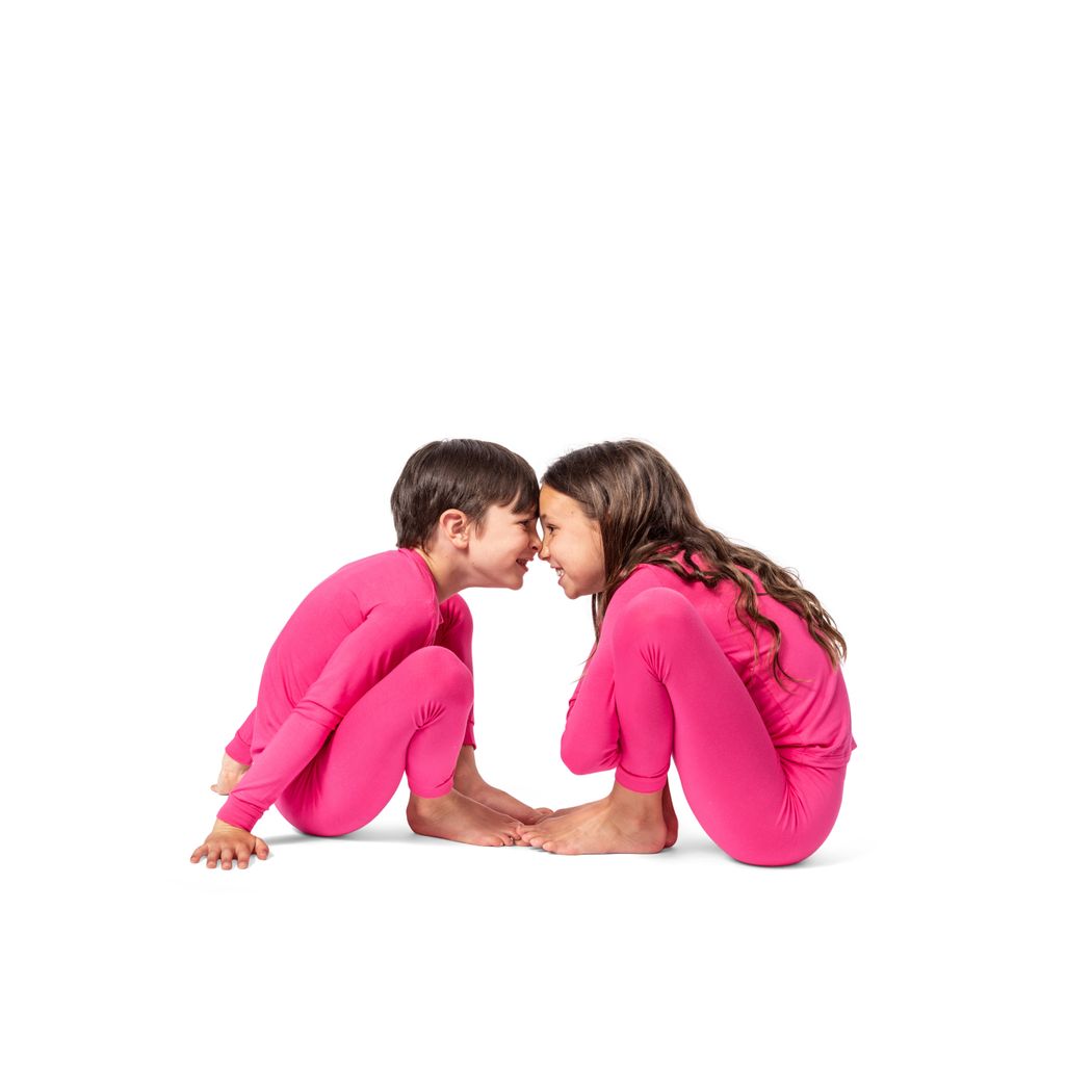 Kids wearing Fuchsia Kids Bamboo PJs in pink together