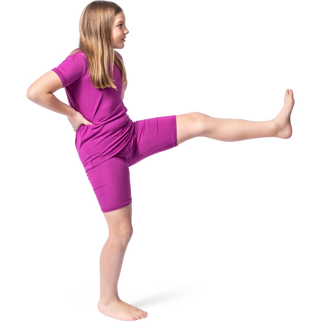 Girl wearing Fuchsia Bamboo Shorties PJ Set in pink, side view