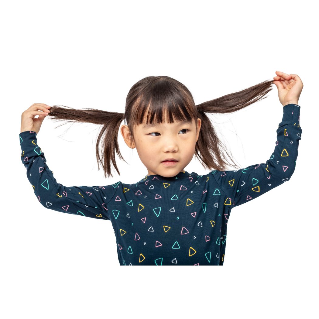 Close-up detail of girl wearing Geo Kids Bamboo PJs in navy