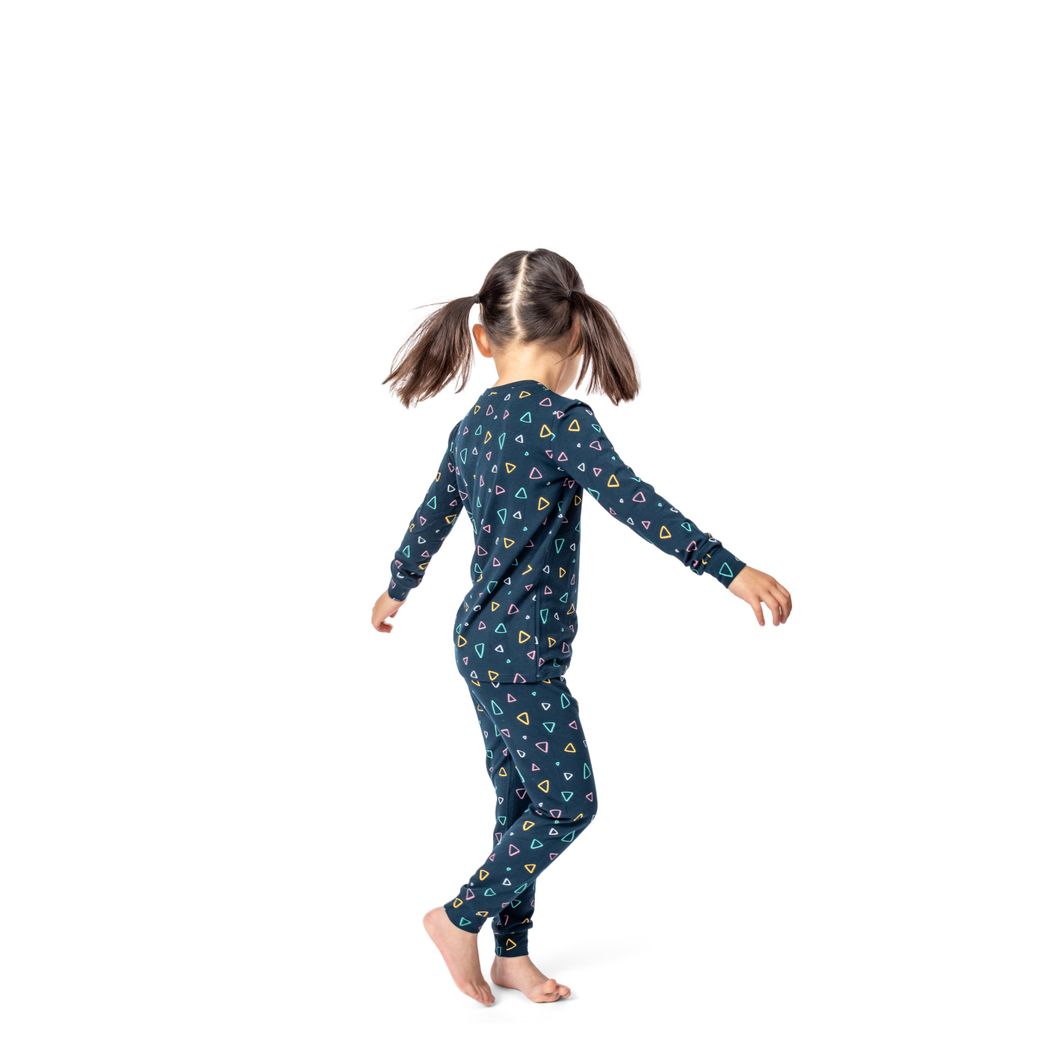 Girl wearing Geo Kids Bamboo PJs in navy, side view