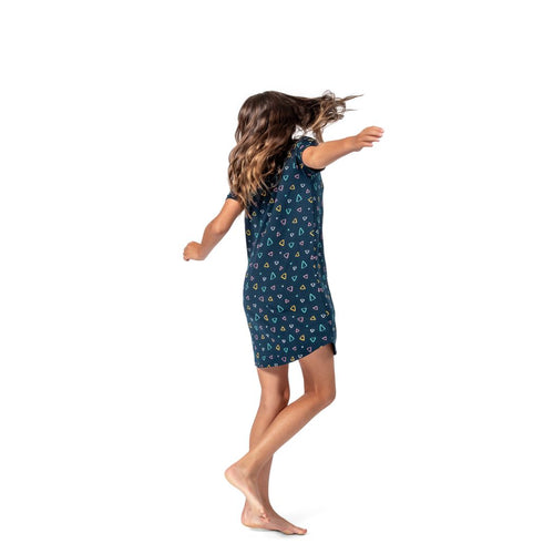 Girl wearing Geo Kids Snuggle Dress in navy, side view