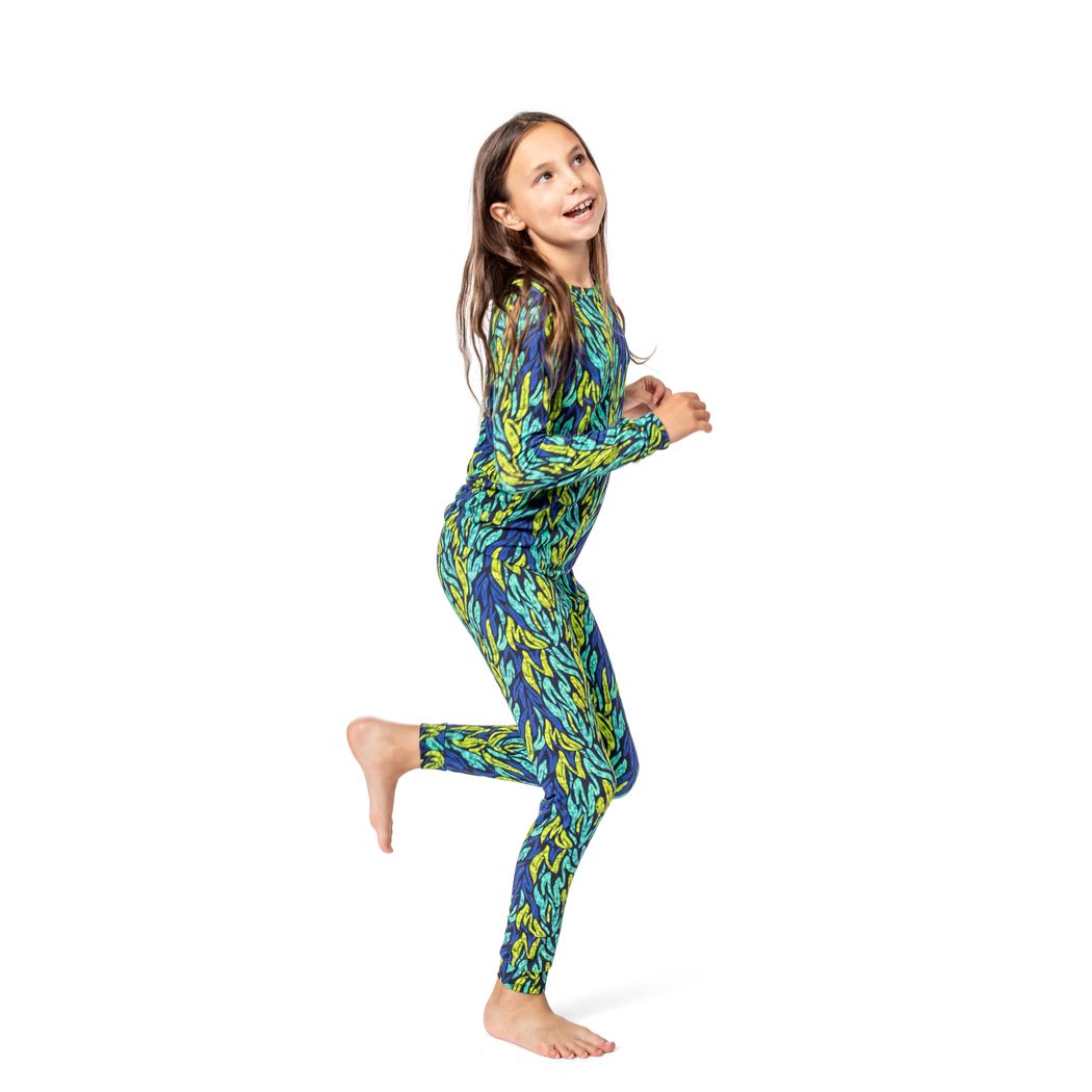 Girl wearing Midnight Jungle Kids Bamboo PJs in green, front view