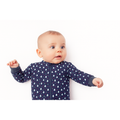 Baby wearing Midnight Pines Bamboo Zip Sleeper in navy, front view