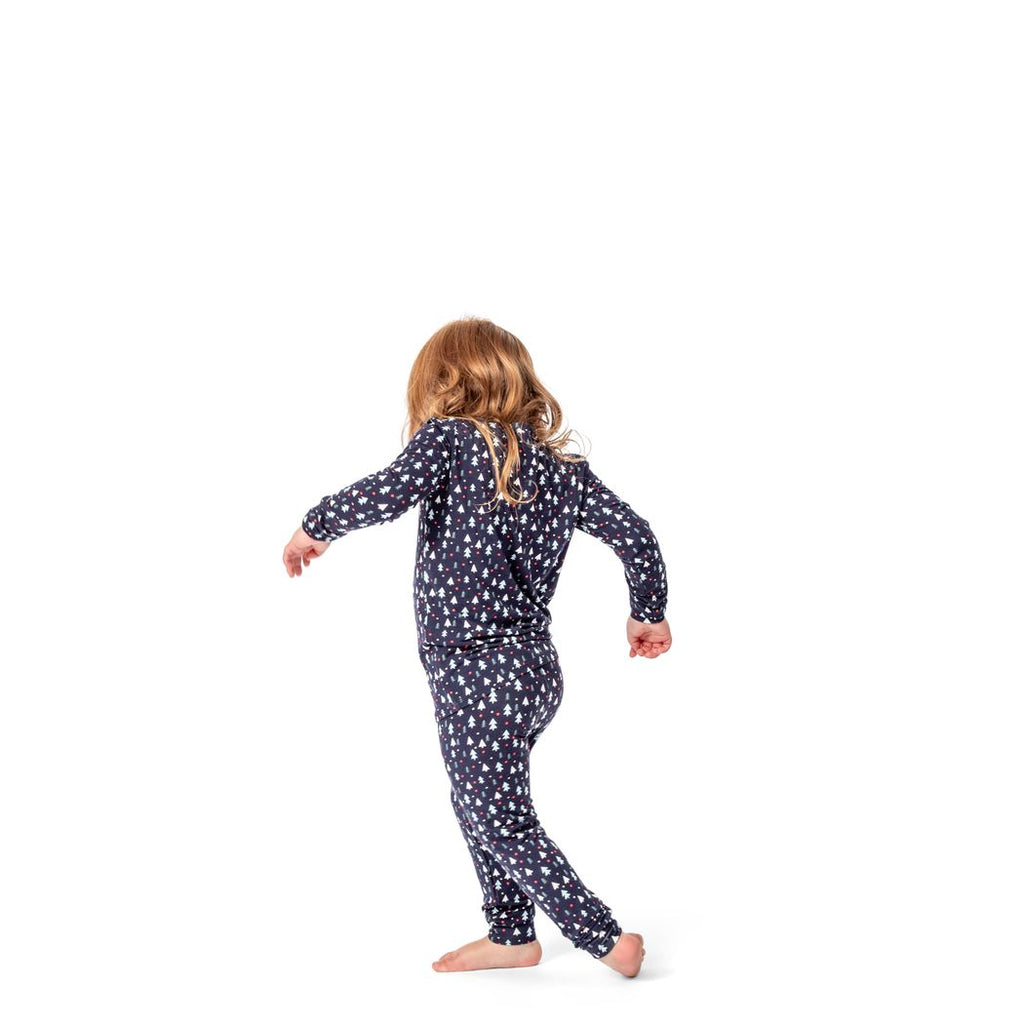 Girl wearing Midnight Pines Kids Bamboo PJs in navy, front view