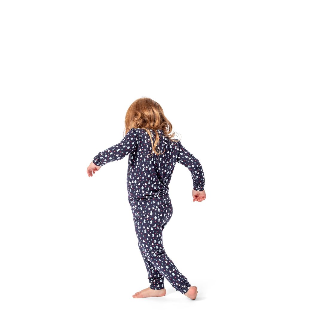 Girl wearing Midnight Pines Kids Bamboo PJs in navy, front view