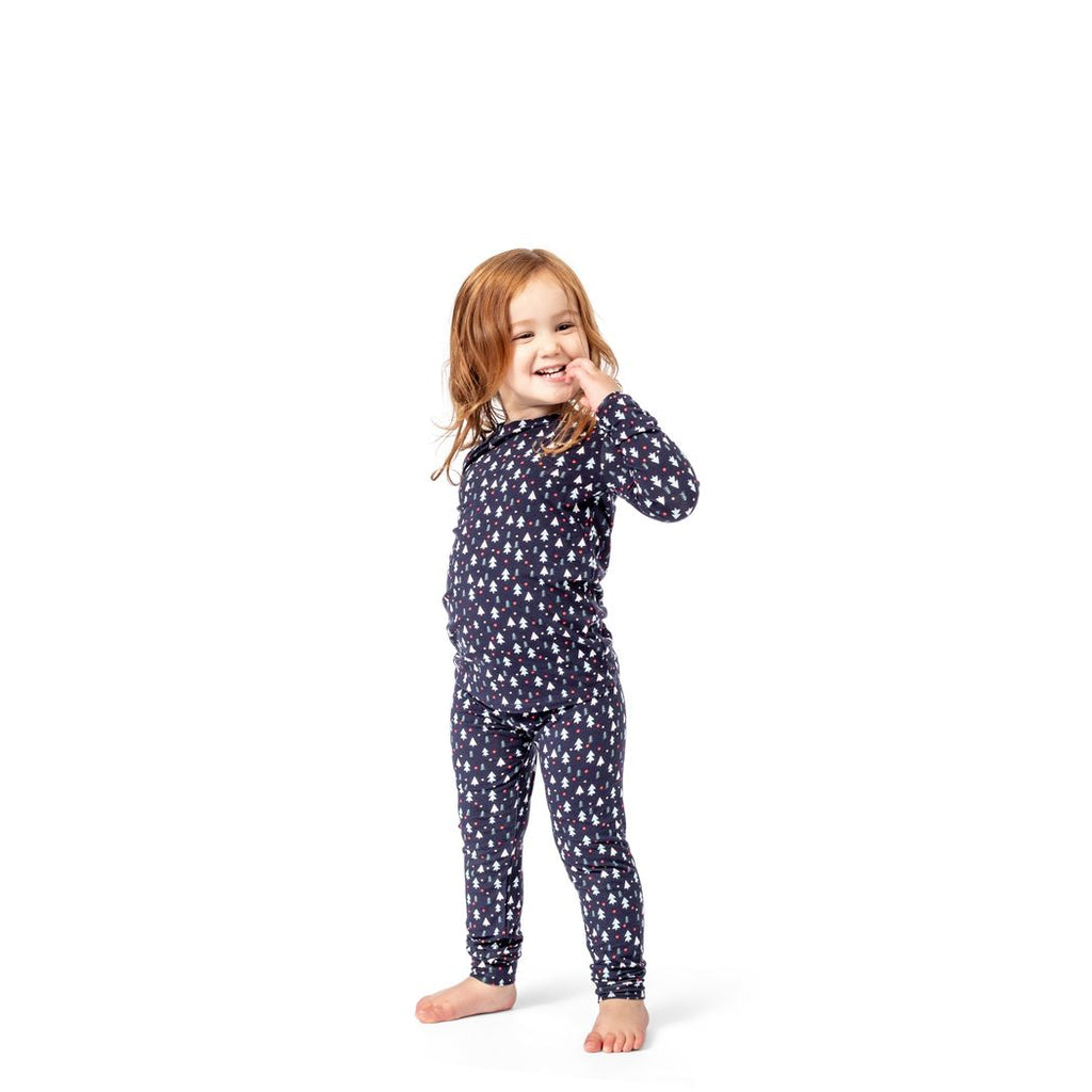 Girl wearing Midnight Pines Kids Bamboo PJs in navy, front view