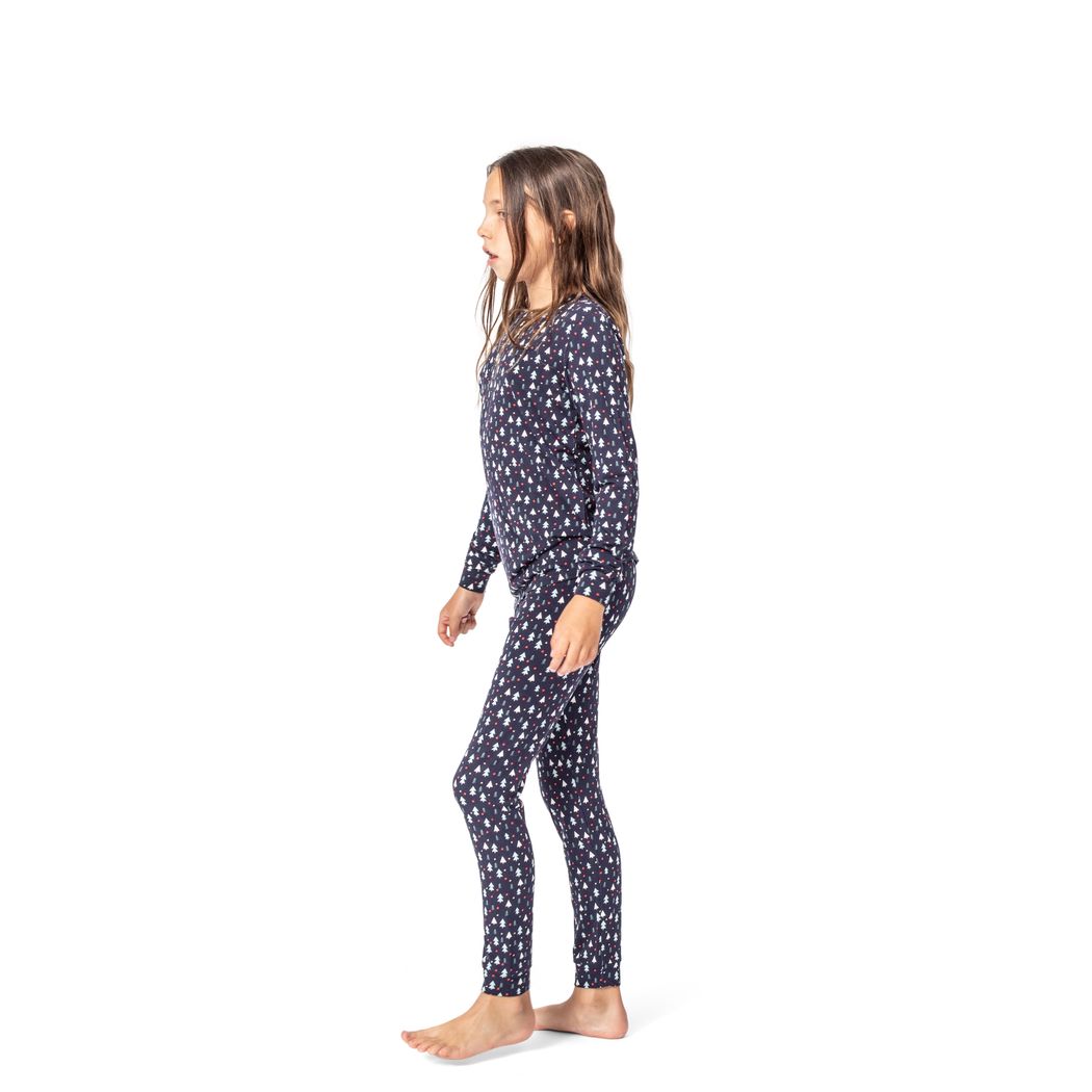 Girl wearing Midnight Pines Kids Bamboo PJs in navy, side view