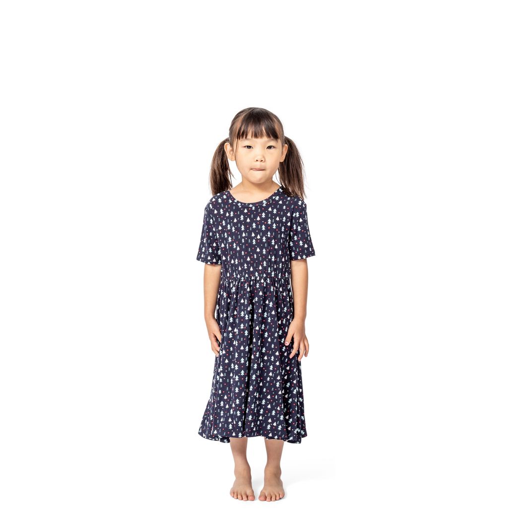 Girl wearing Midnight Pines Twirl Dress in navy, front view