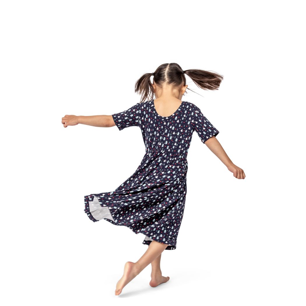 Girl wearing Midnight Pines Twirl Dress in navy, side view