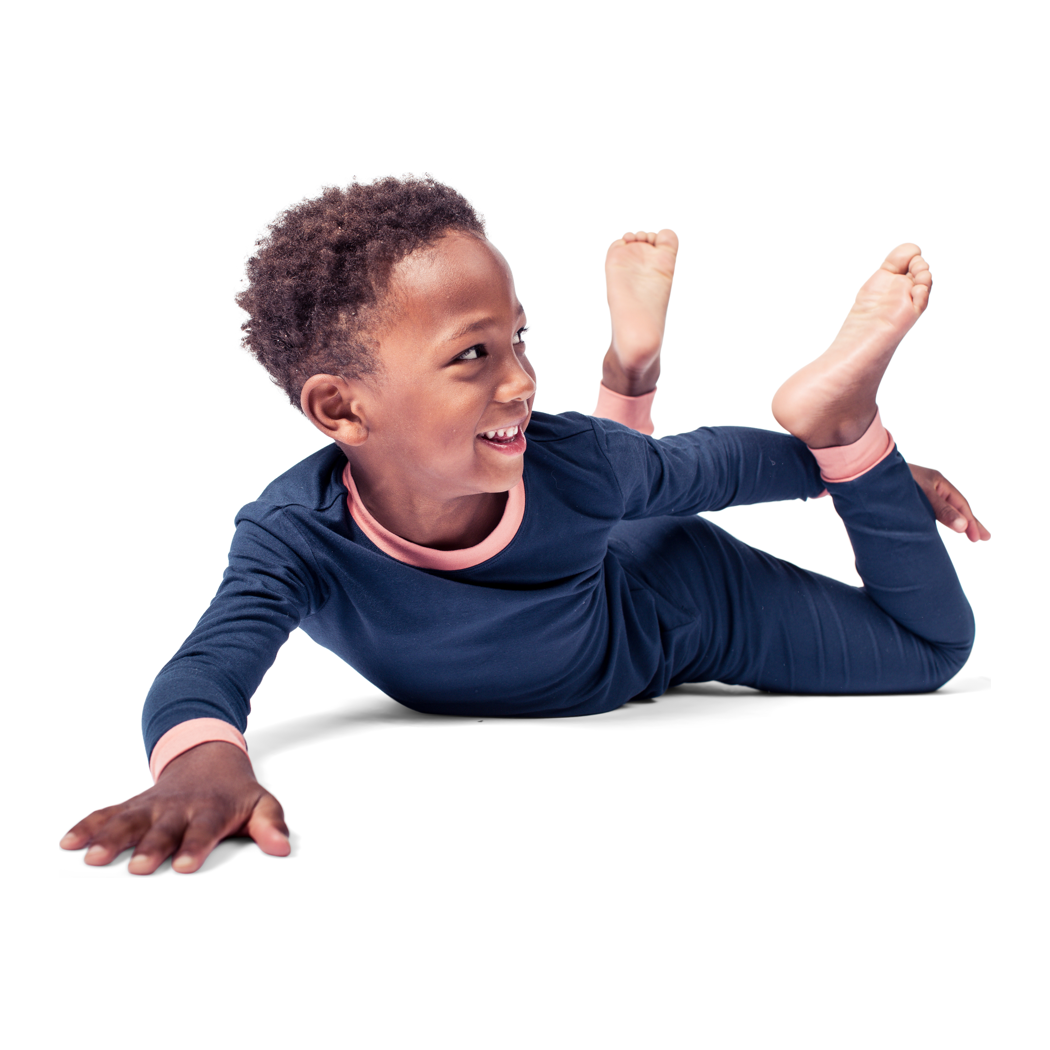 Boy wearing Midnight Kids Bamboo PJs in navy, lifestyle photo