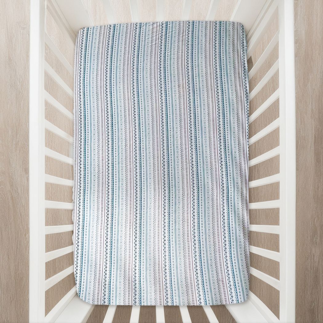 Nordic Baby Bamboo Crib Sheet in neutral tones styled in a lifestyle setting