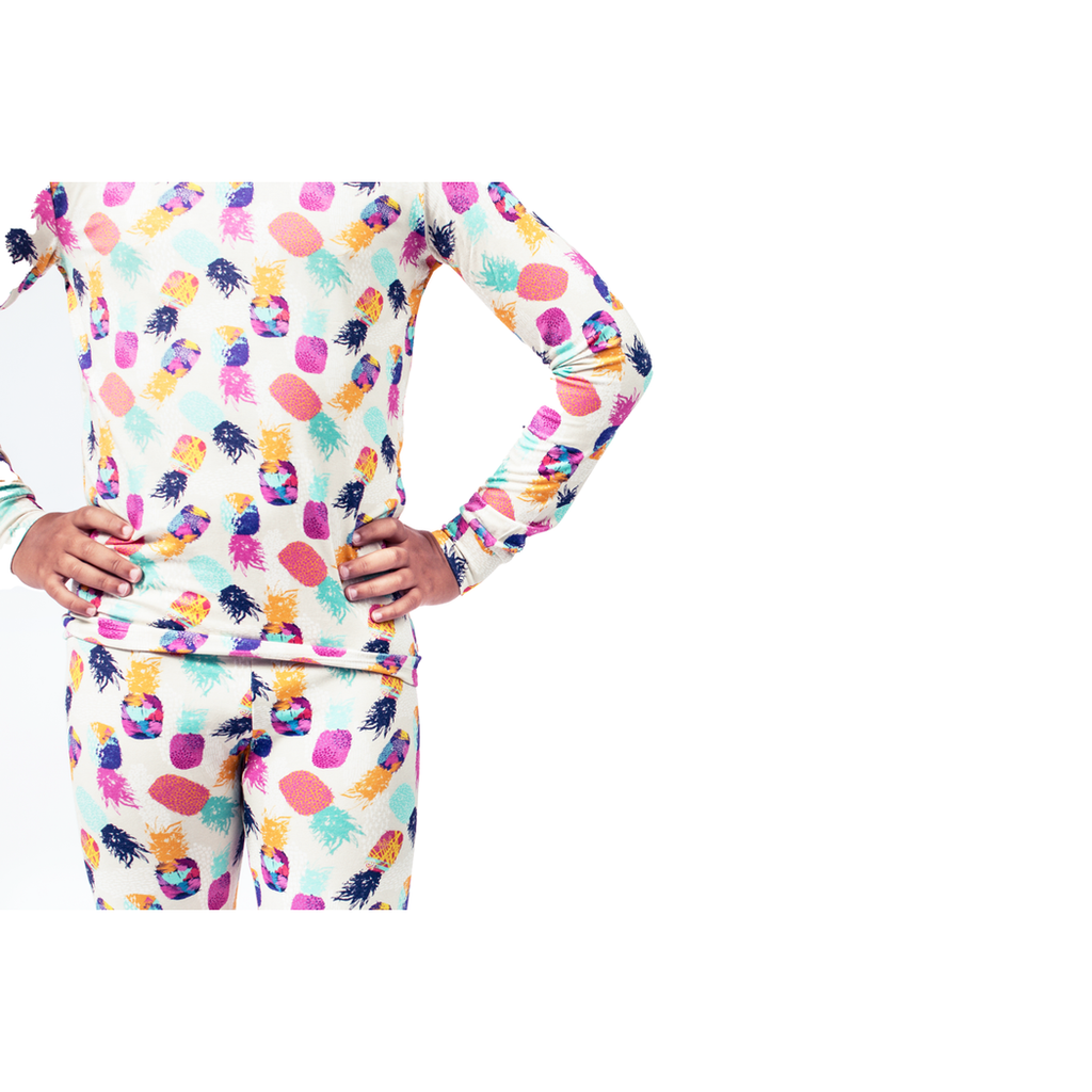 Close-up detail of child wearing Pineapple Kids Bamboo PJs in multicolor