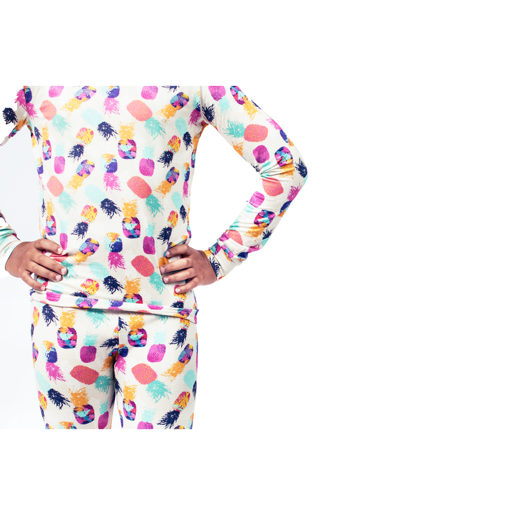 Close-up detail of child wearing Pineapple Kids Bamboo PJs in multicolor