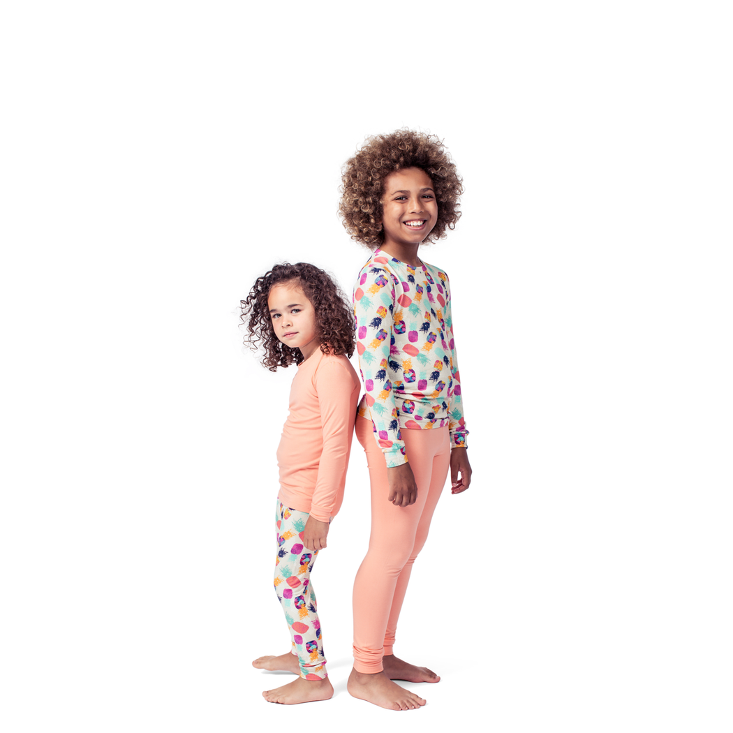 Kids wearing Pineapple Kids Bamboo PJs in multicolor together