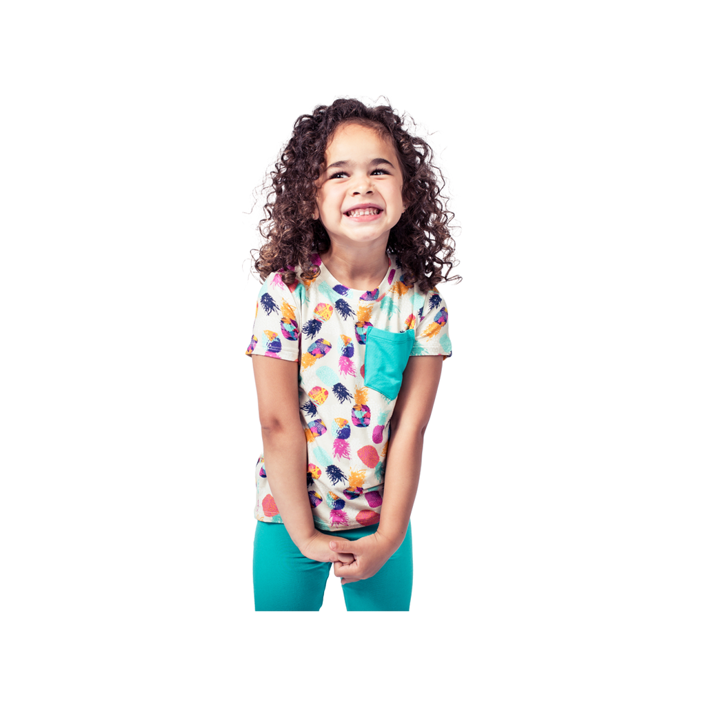 Girl wearing Pineapple Kids T-Shirt in multicolor, front view