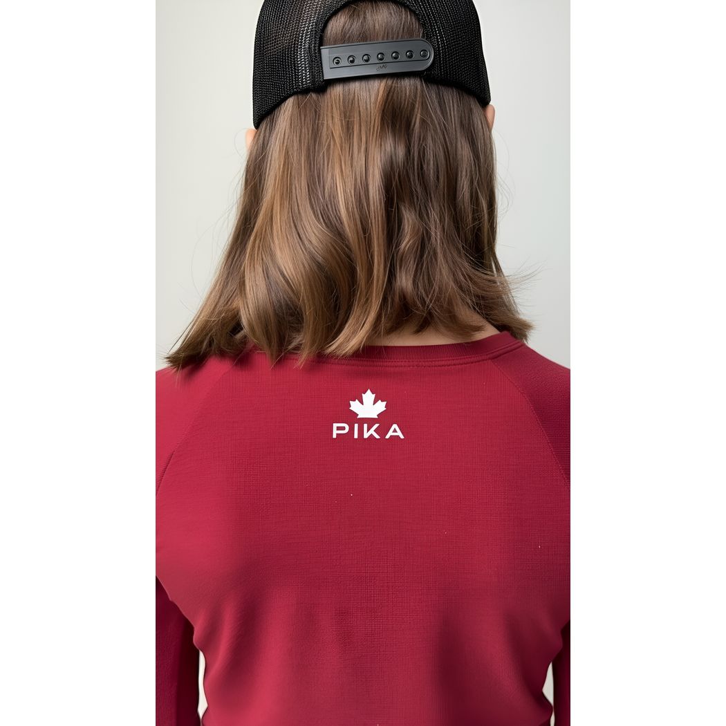 Girl wearing Red Kids Merino Wool & Tencel Base Layer Set, back view