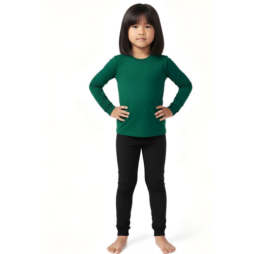 Girl wearing Spruce Kids Bamboo PJs in green, front view