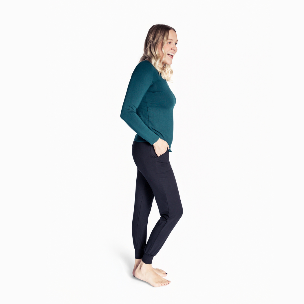 Woman wearing Spruce Womens Long Sleeve Pant Set in green, side view