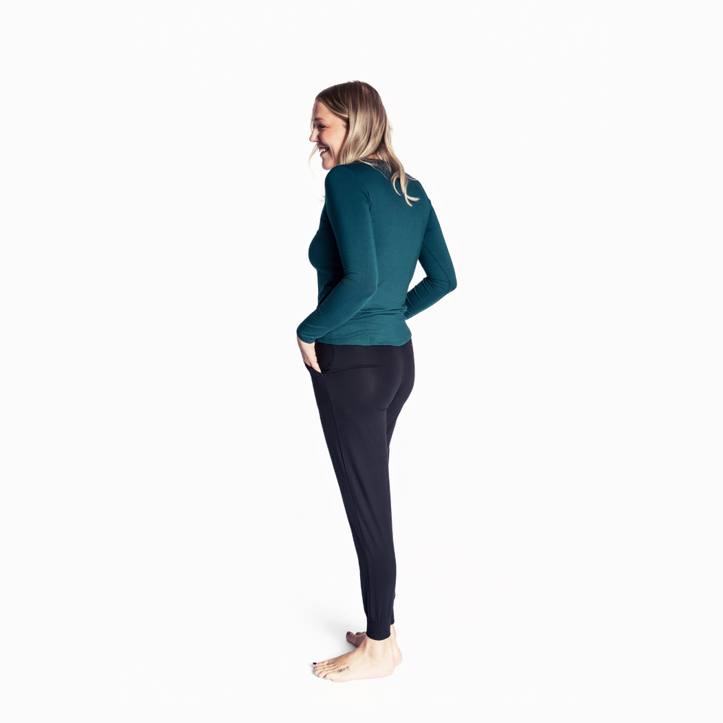 Woman wearing Spruce Womens Long Sleeve Pant Set in green, side view