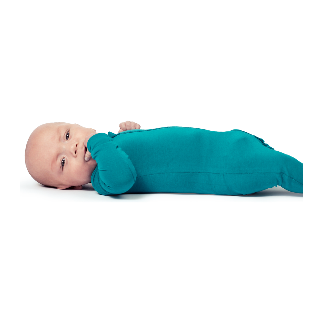 Baby wearing Tahiti Bamboo Zip Sleeper in blue, front view