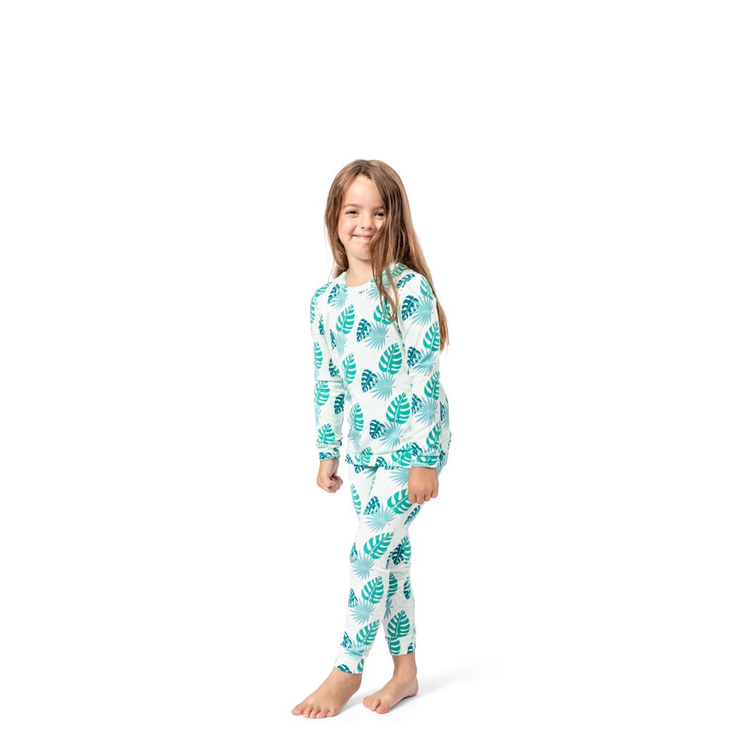 Girl wearing Tropicana Kids Bamboo PJs in mint, front view